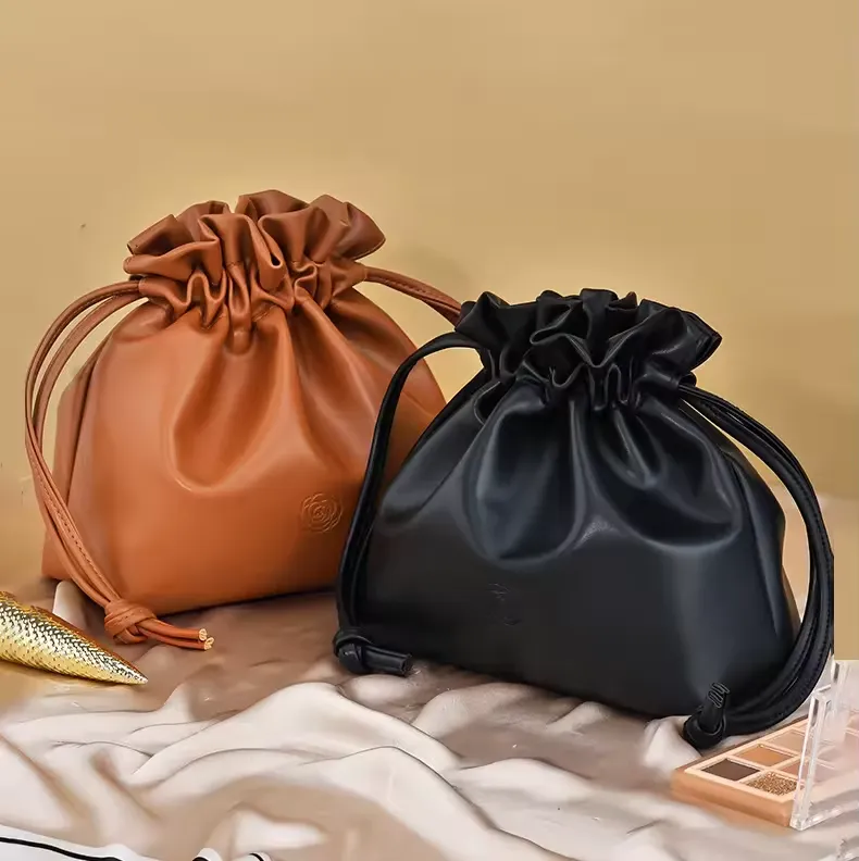 PU cosmetic bag manufacturer - Assorted colors drawstring makeup bags with embossed rose detail for custom OEM production