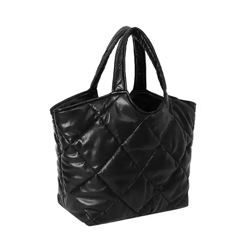 Quilted tote bag side view - Manufacturing precision for wholesale fashion accessory factory showing production quality