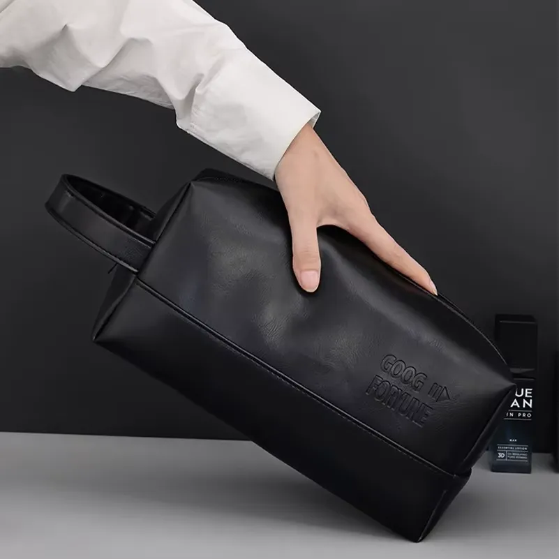 Black PU cosmetic bag - Embossed logo detail for wholesale travel accessory production