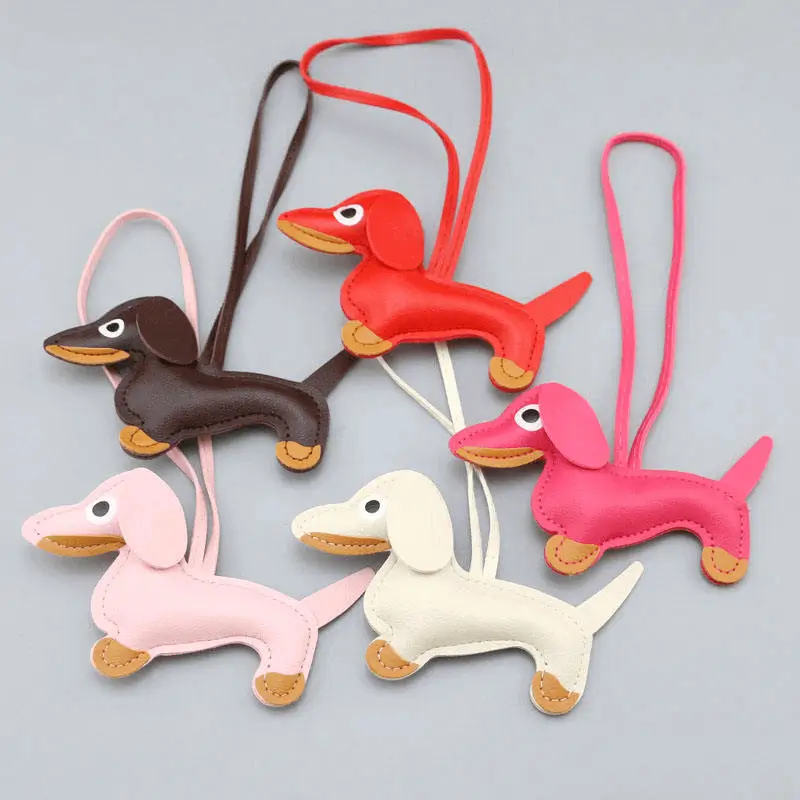 Dachshund keychain manufacturer - Embroidered cartoon sausage dog with detailed features for custom OEM production