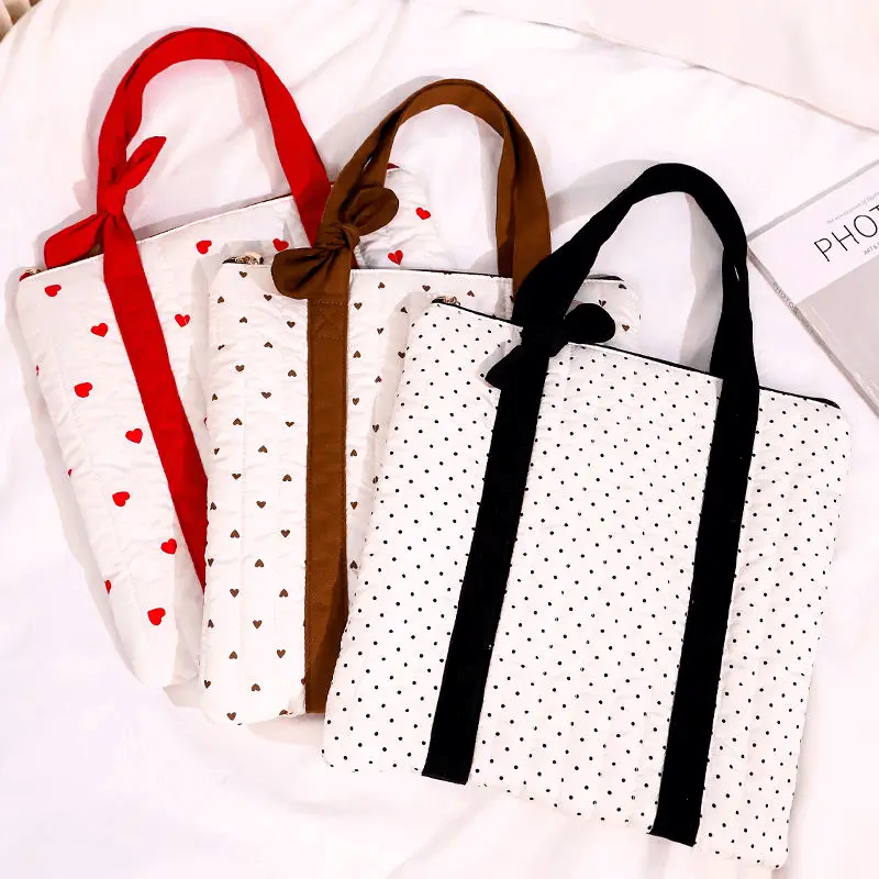 Cotton laptop bag manufacturer - Quilted cotton laptop bag with bow handle and heart design for boutique tech accessory OEM production