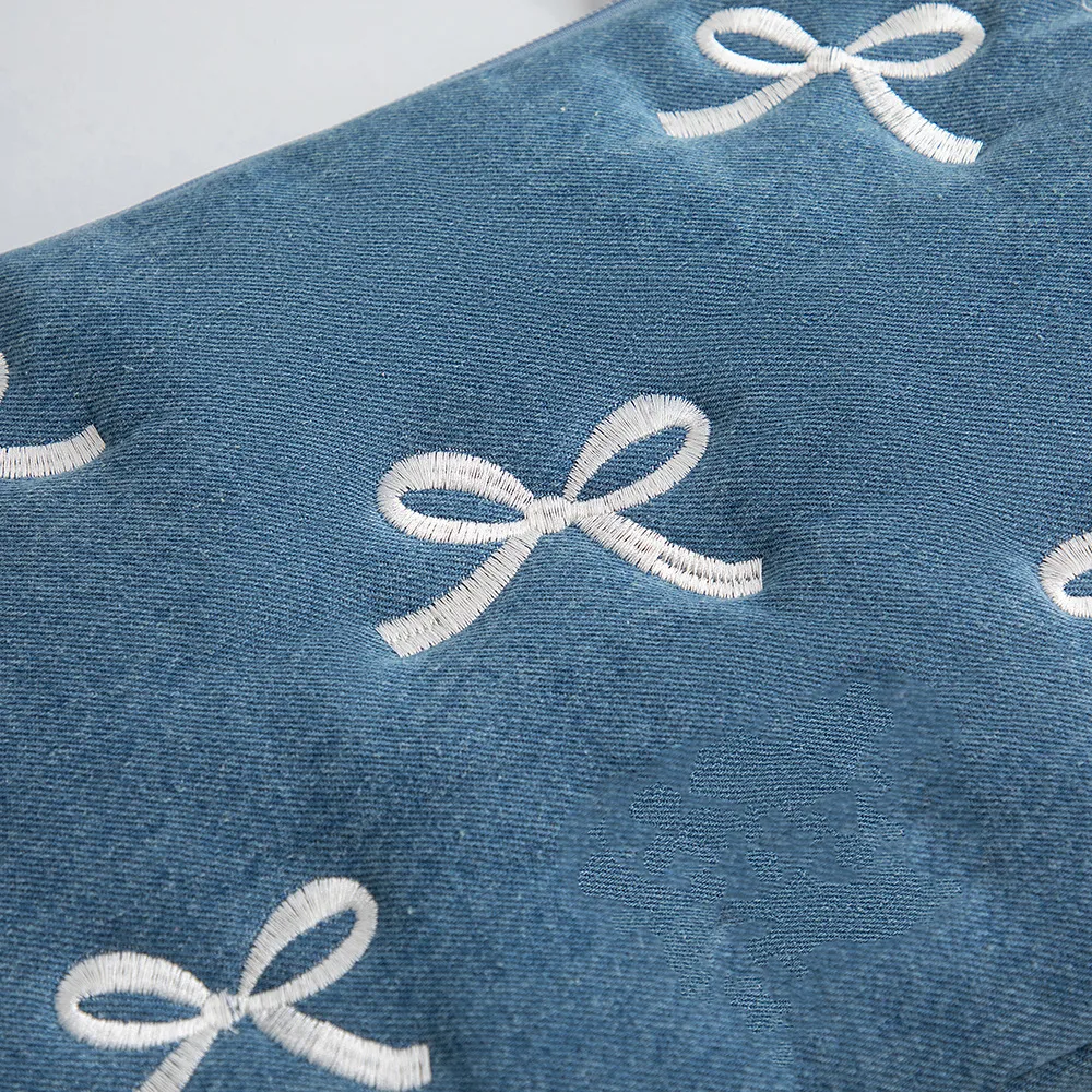 Front view of vintage denim embroidered MacBook briefcase for OEM production