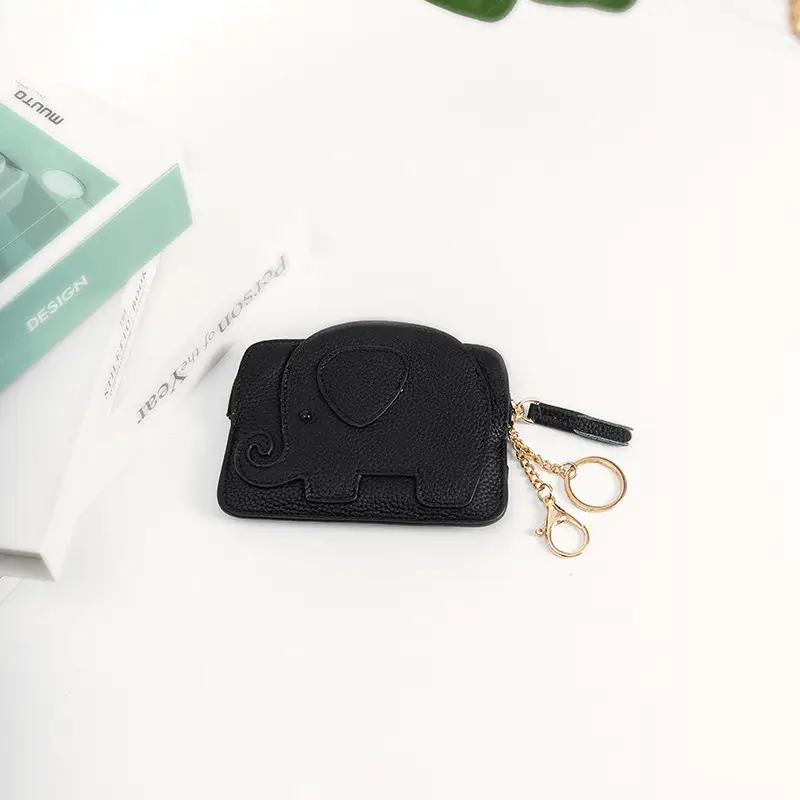 Elephant wallet capacity demonstration - Production quality for custom novelty accessory manufacturing showing coin storage