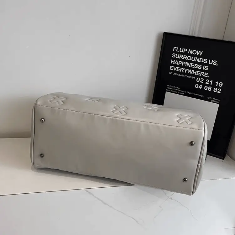 Custom leather duffel bag manufacturer - Metal rivet reinforcement showing premium construction