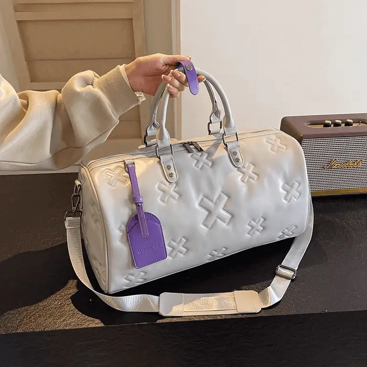 Premium leather bag manufacturer - Purple accent tag detail for luxury branding