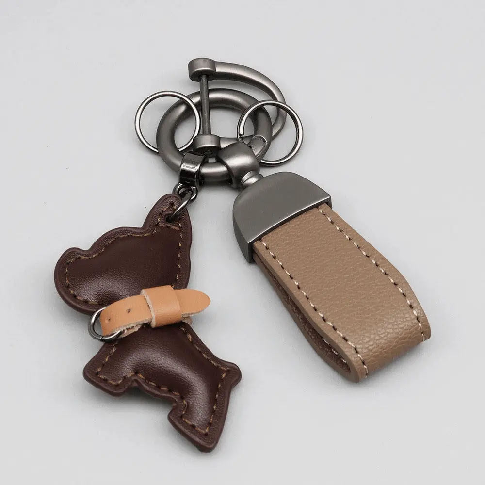 Brown French Bulldog keychain production - Premium leather texture and detailed manufacturing for OEM clients