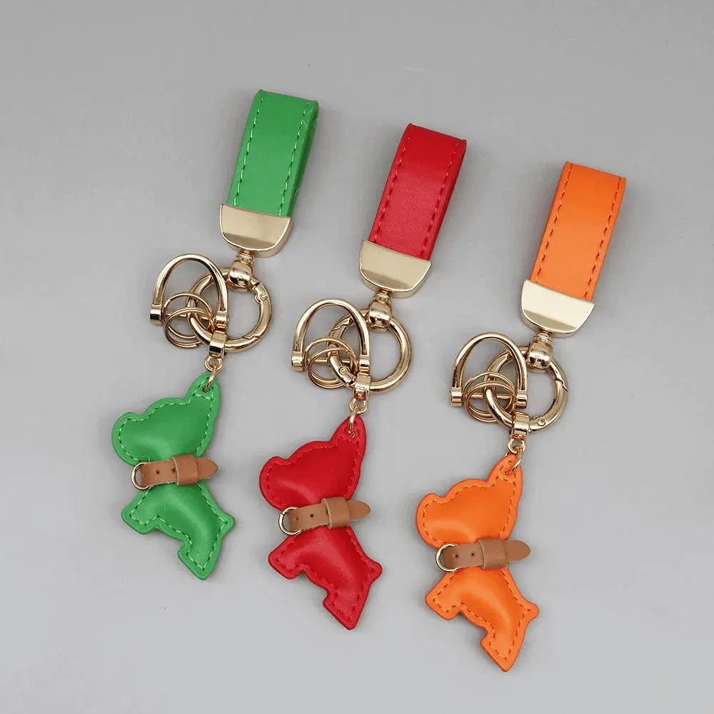Premium hardware integration - Green red orange keychains with gold metal components for luxury accessory production