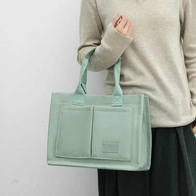 Dual-carry tote back view - OEM manufacturing precision for wholesale fashion accessories showing minimalist design