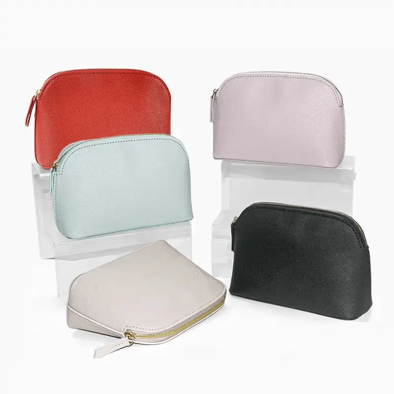 Leather cosmetic bag manufacturer - Pink shell shape makeup bag with minimalist design for custom OEM production