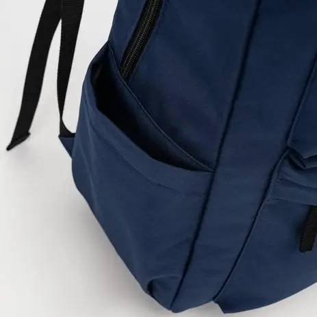 Side pocket detail showing storage - men's backpack factory production