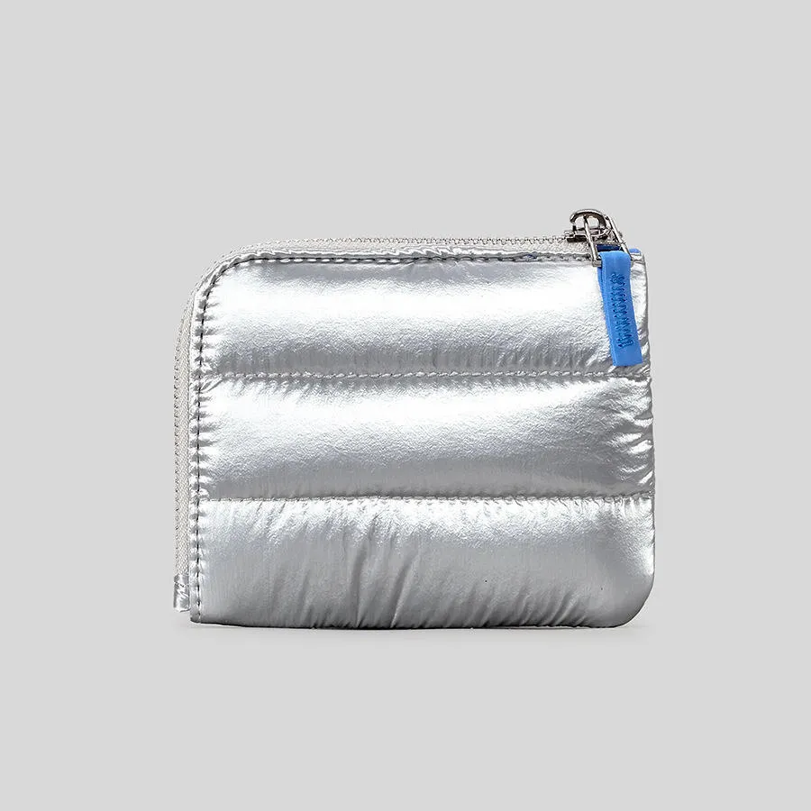 Compact size demonstration of shimmering pink quilted wallet