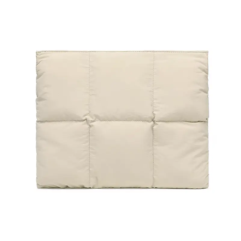 Detailed view of cream puffer laptop bag - Quality craftsmanship and premium nylon for custom fashion accessory manufacturing