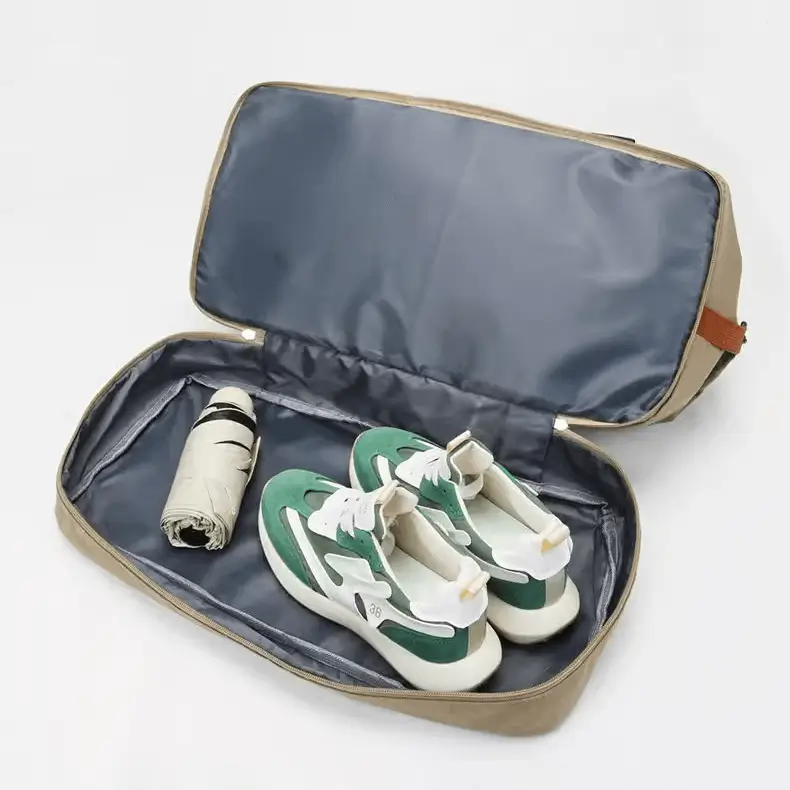 Wholesale weekender bag supplier - Bottom shoe compartment showing specialized storage features