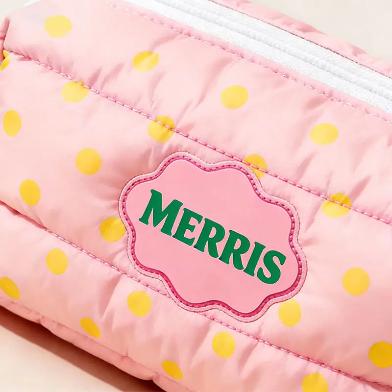 Scalloped logo patch detail - Custom branding and embroidery for wholesale distribution