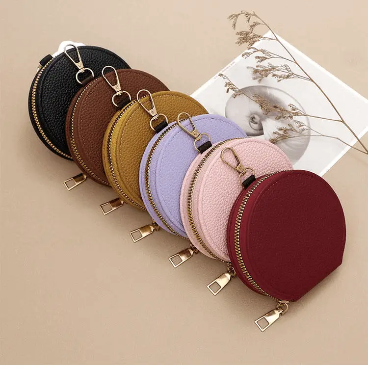 Round mini hanging bag manufacturer - Premium pebbled leather bag with carabiner clip technology for custom OEM accessory production