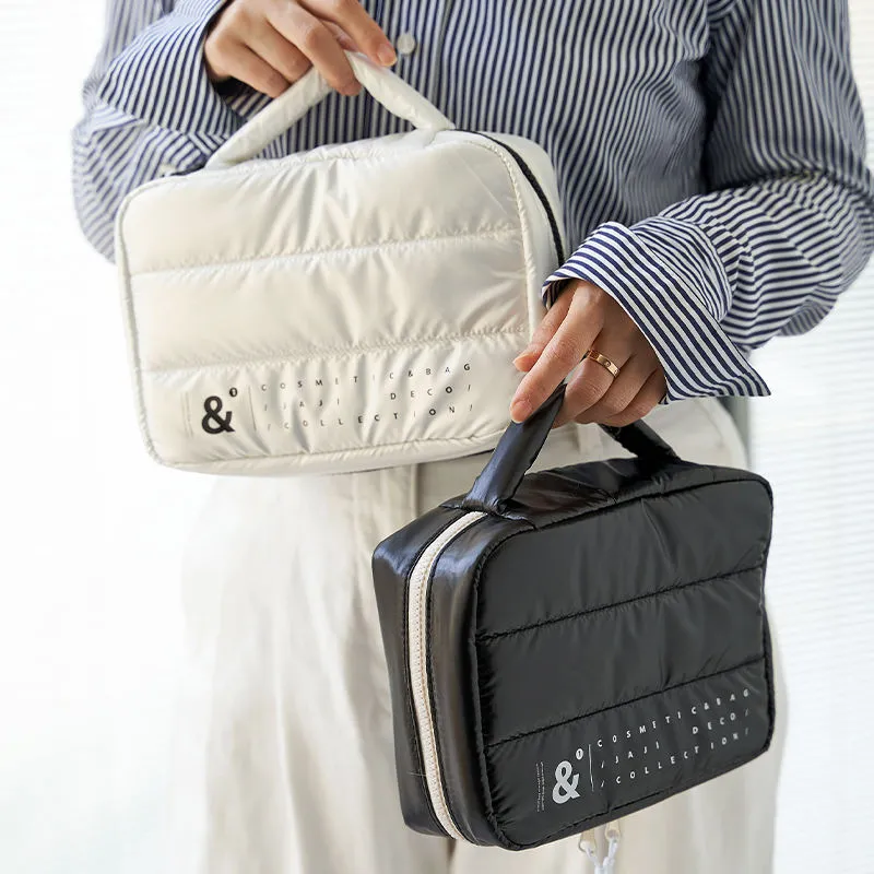 Dual color puffy cosmetic bags - Black and white options for wholesale beauty accessory production