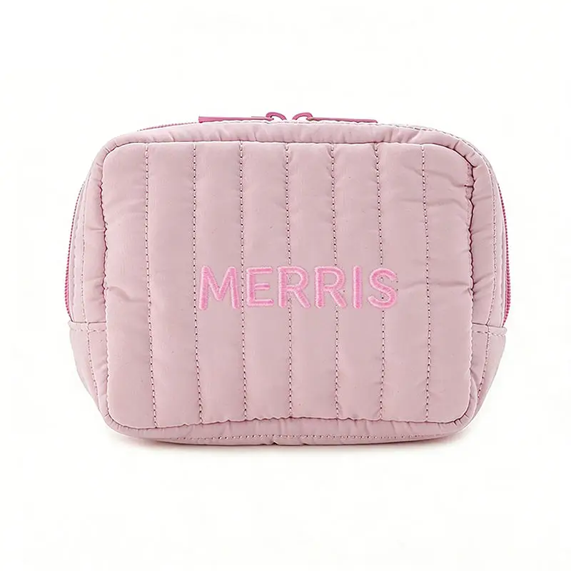 Pink quilted cosmetic bag - Embroidered branding detail for wholesale beauty accessory production