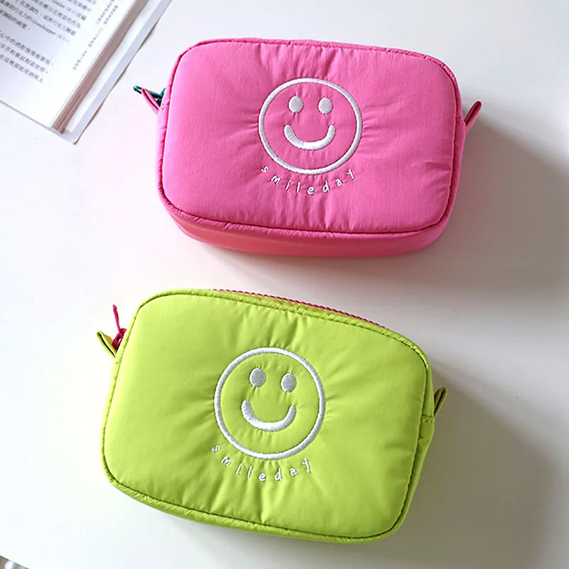 Polyester cosmetic bag manufacturer - Bright pink and lime green quilted smiley face makeup bags with embroidery for custom OEM production
