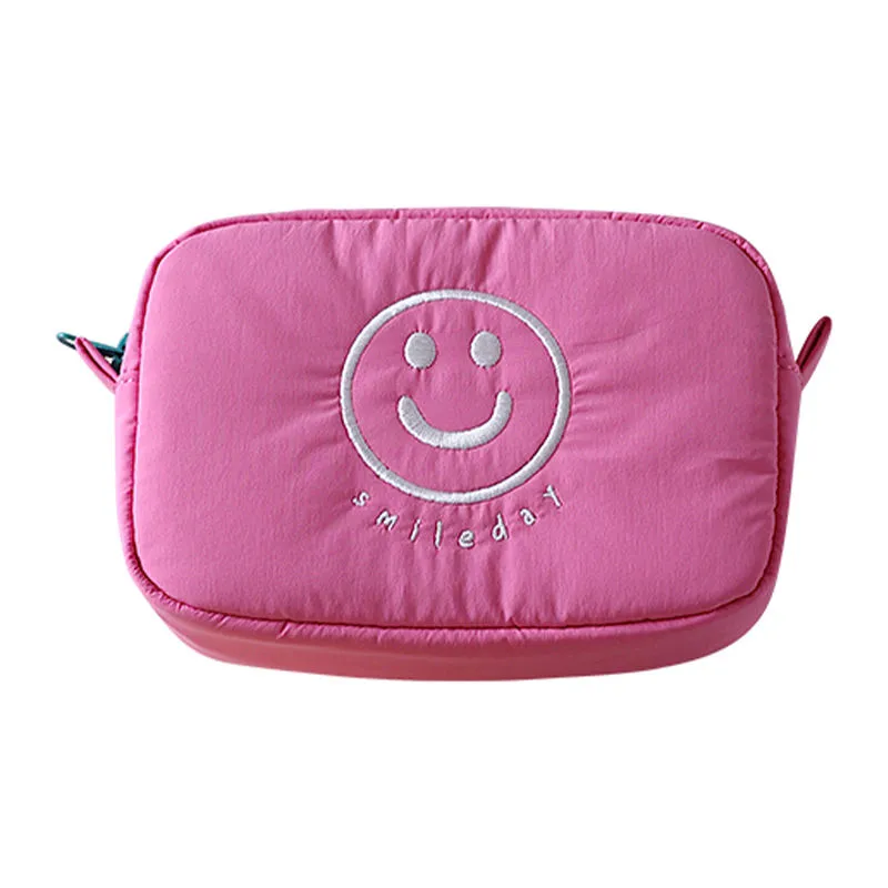 Pink smiley face cosmetic bag detail - embroidery precision for wholesale beauty accessory production