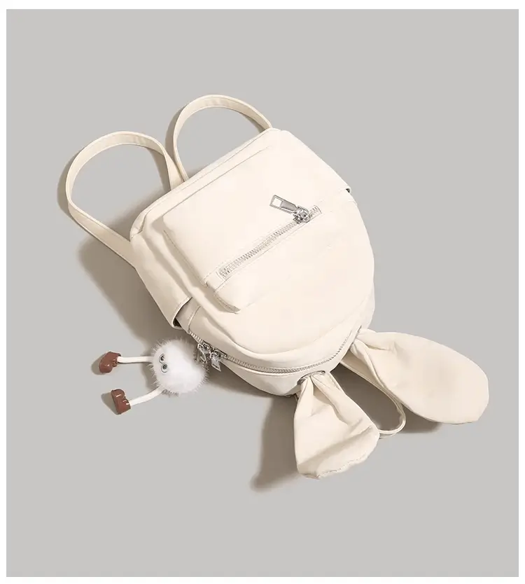 Top view showing handle and drooping ears - custom rabbit backpack manufacturing