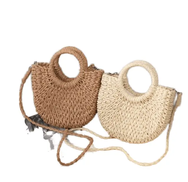 Handmade straw bag manufacturer - Natural brown and beige straw bag with circular handle and artisanal woven craftsmanship for boutique fashion OEM production