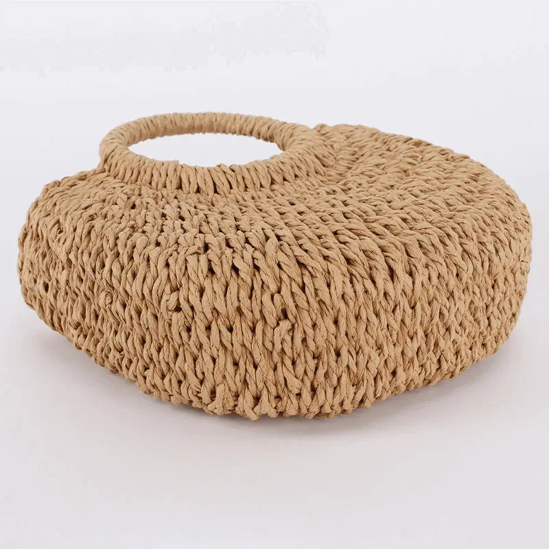 Side profile of brown straw bag - Structured shape and artisanal construction for wholesale boutique merchandise