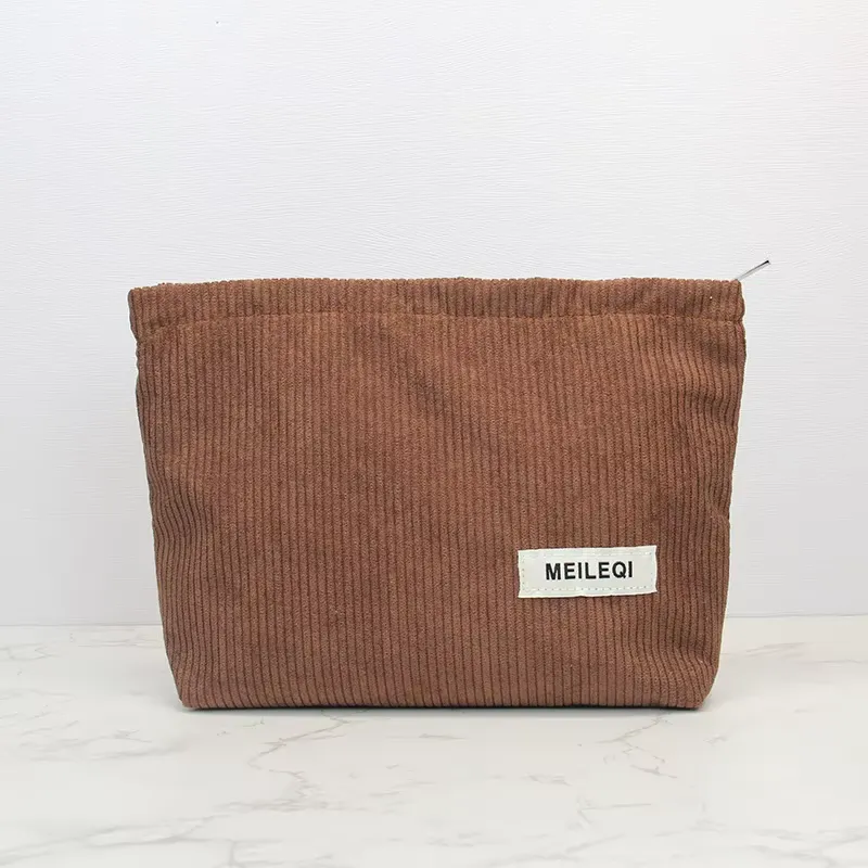 Deep brown corduroy cosmetic bag stitching detail - Construction precision for wholesale distribution