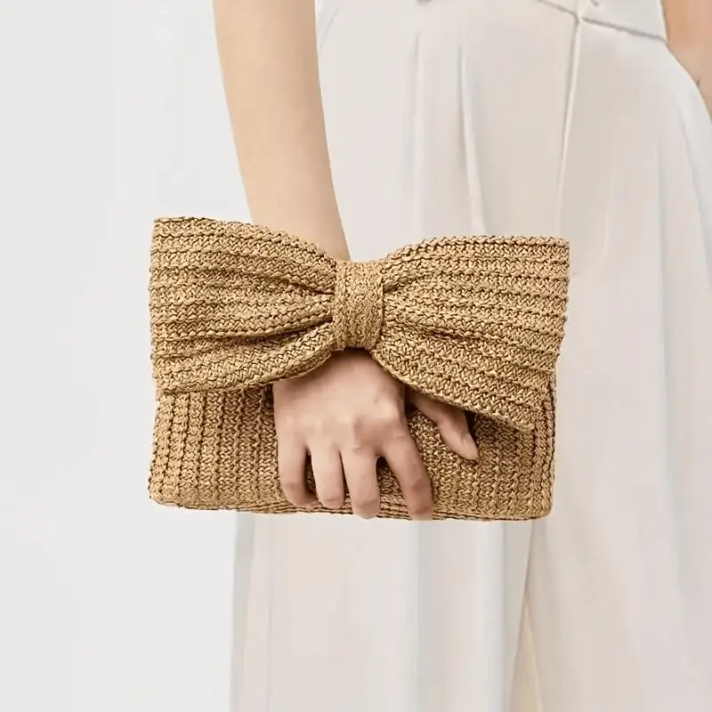 Straw clutch bag manufacturer - Natural straw bag with oversized bow design and handwoven texture for boutique fashion OEM production